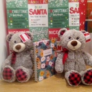 A Notebook and Two stuffed animals.